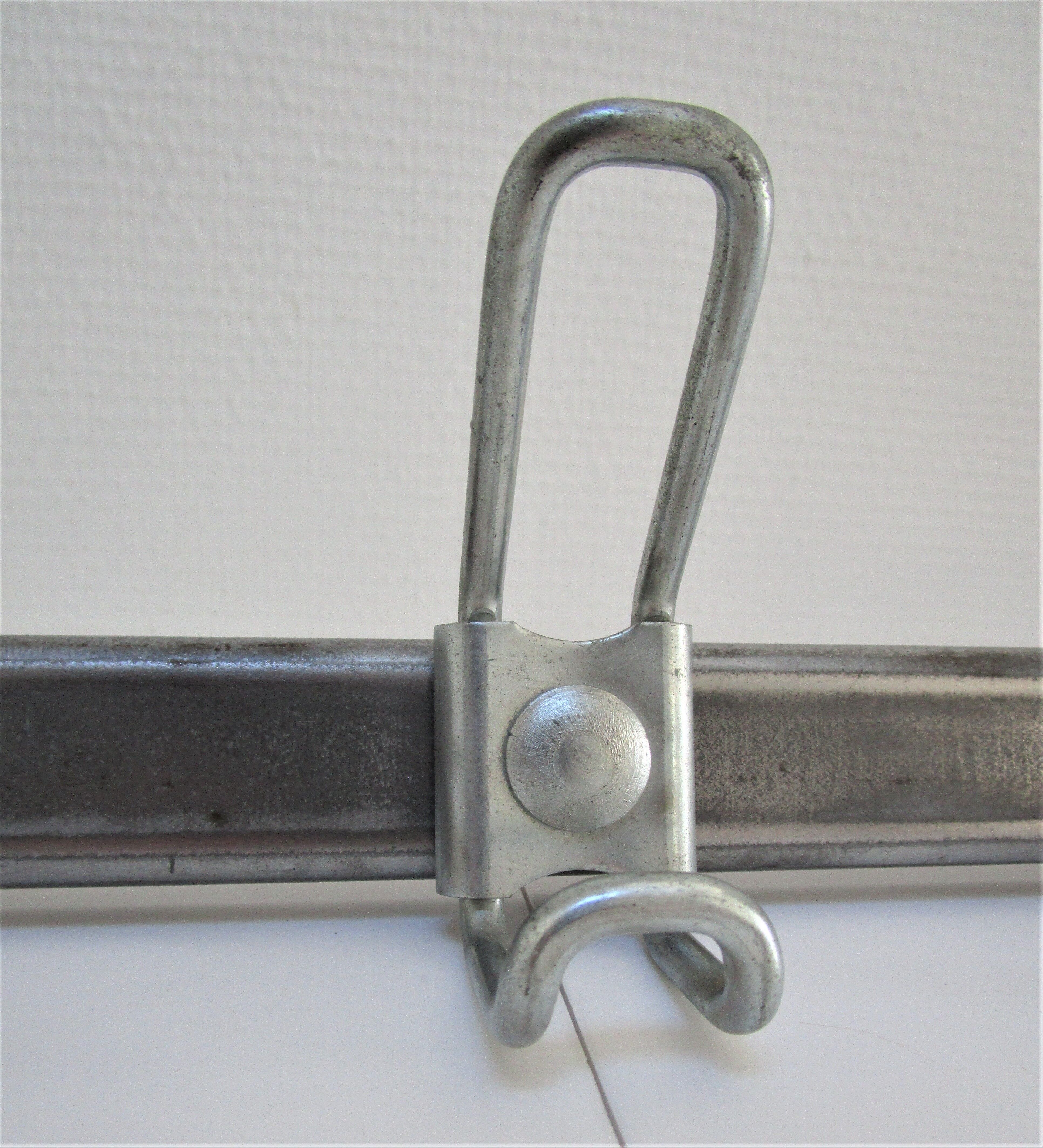 Vintage school wall rack in patinated steel