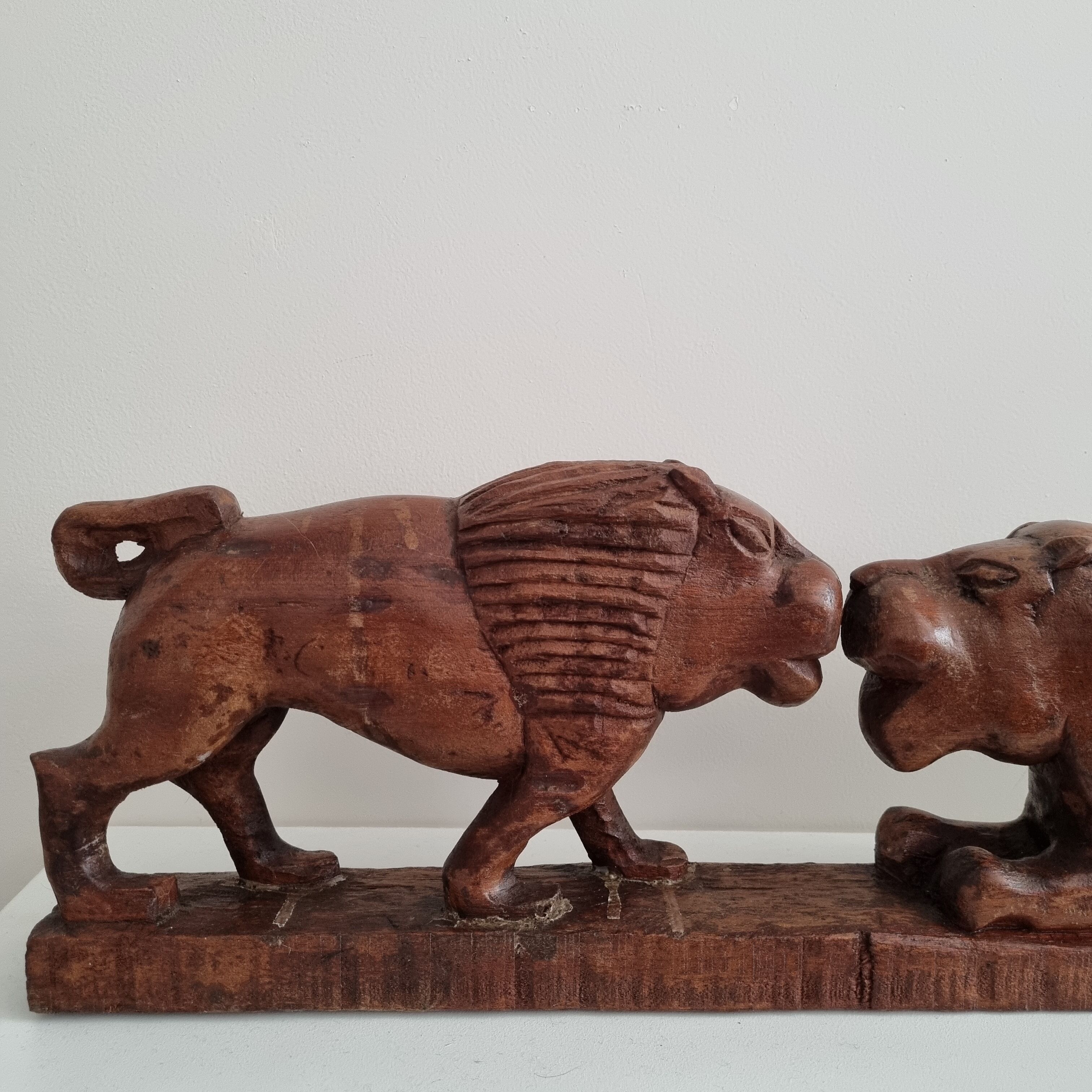 Lion and hippopotamus wood sculpture