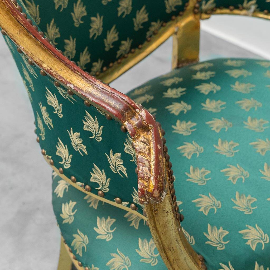 Pair of Louis XV style gilded armchairs with vintage green fabric
