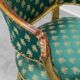 Pair of Louis XV style gilded armchairs with vintage green fabric