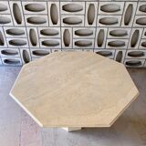 Light-colored octagonal travertine dining table