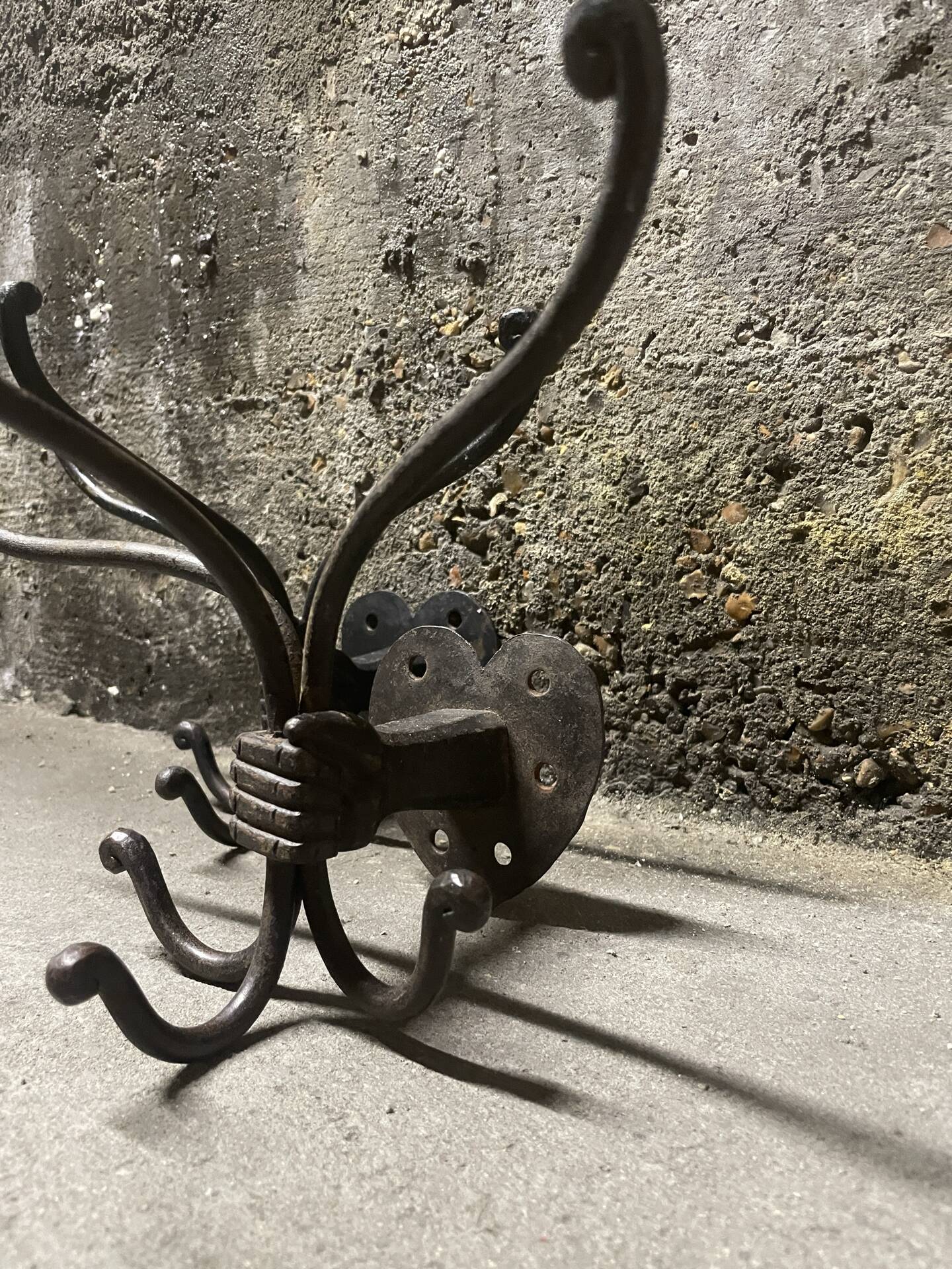 Brutalist pair of wall-mounted coat hooks.