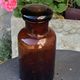 Jar bottle of herbalism pharmacy in amber colored glass art deco