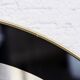 Black and gold 60s round mirror