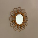 Sun mirror in arched rattan. 40cm. 1960.
