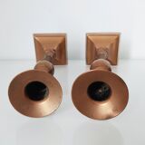 Set of a pair of candle holders and a hand candle holder