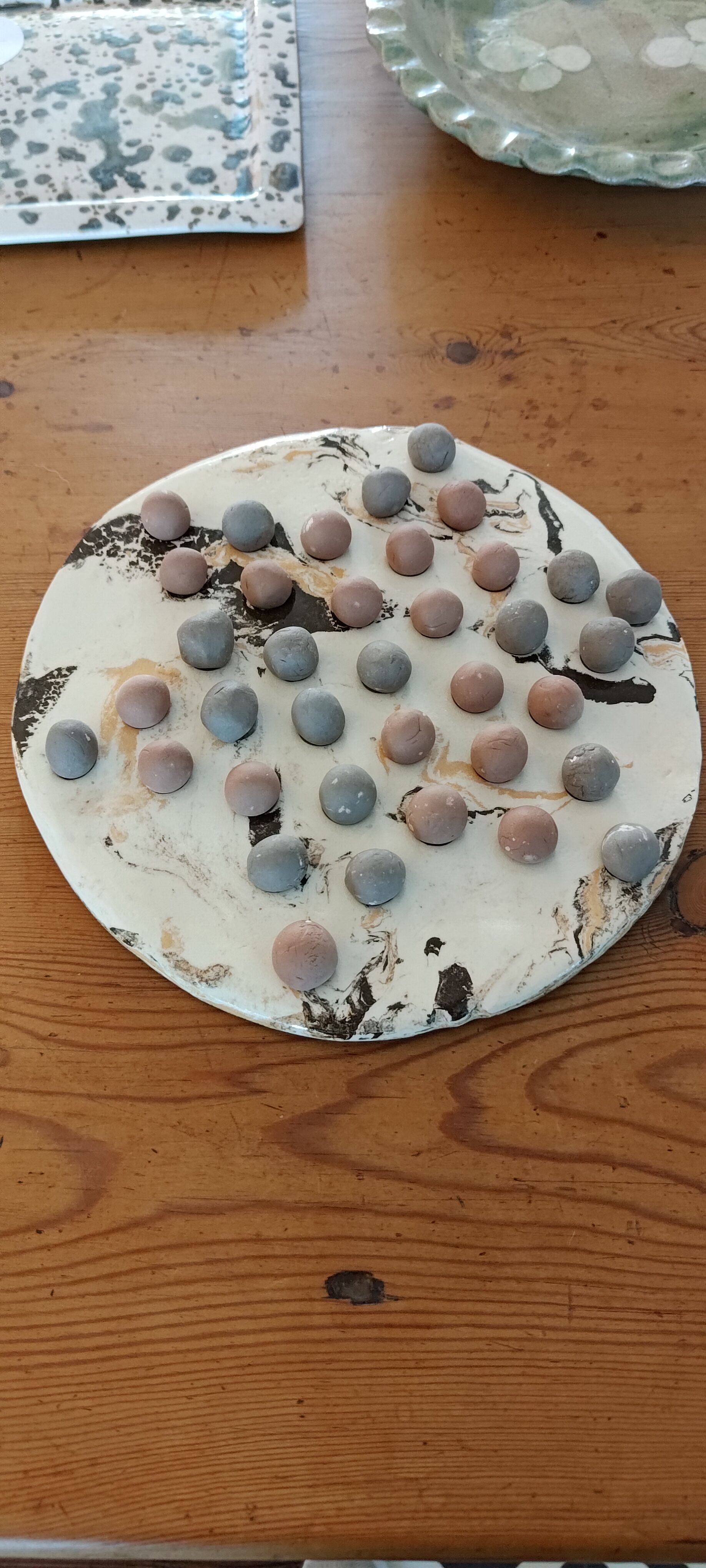 Ceramic solitaire game