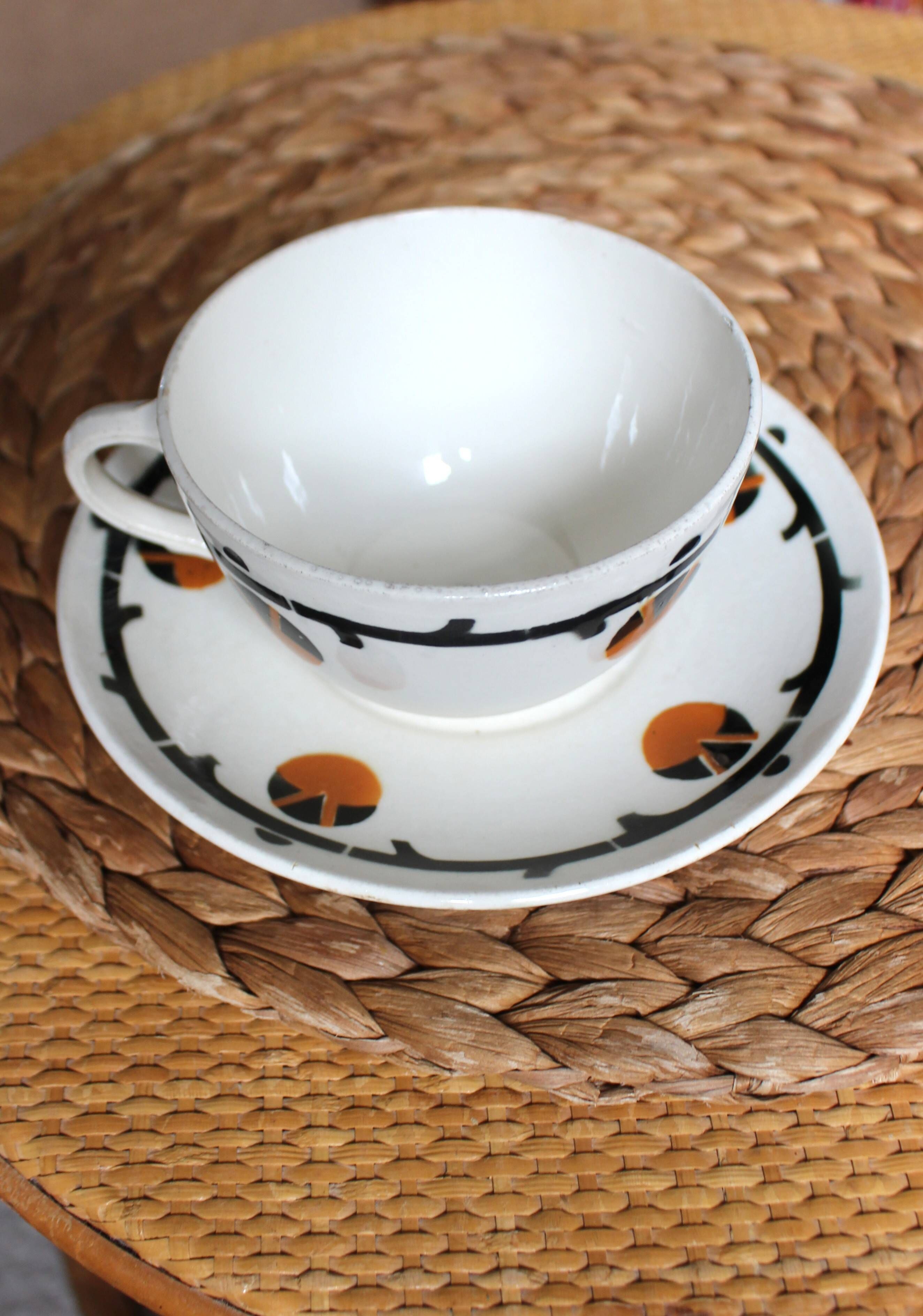 A large cup of chocolate tea, saucer Badonviller Barcarolle orange black.