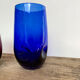 3 blue colored long drink glasses