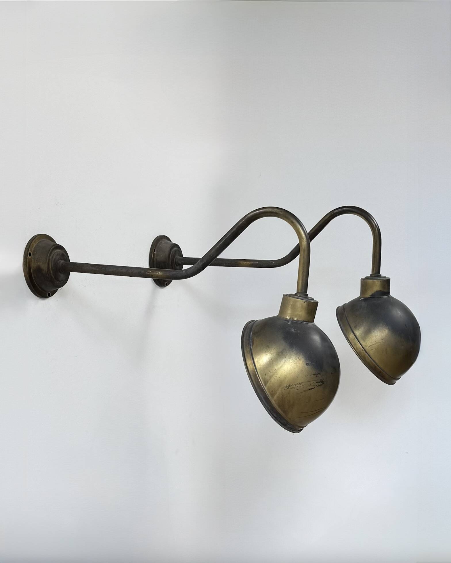 Pair of XL patinated brass wall lights, France, 1970.