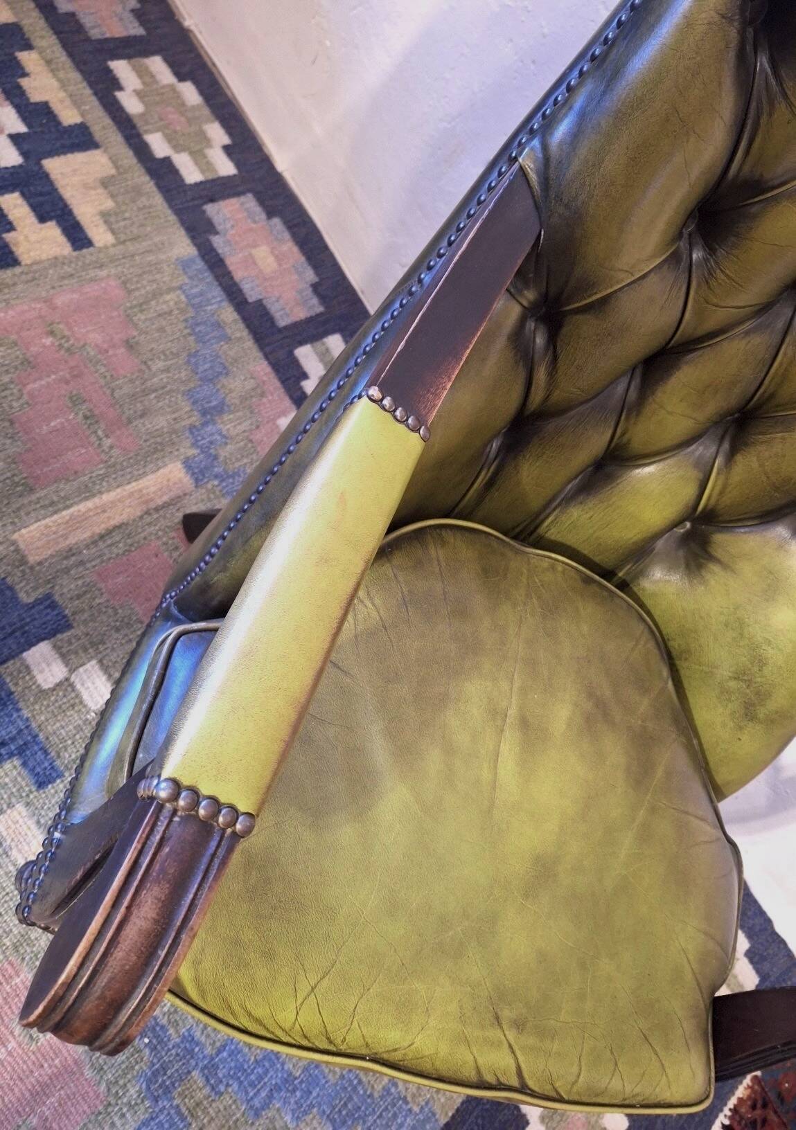 Olive green tufted leather library armchair, 1970s