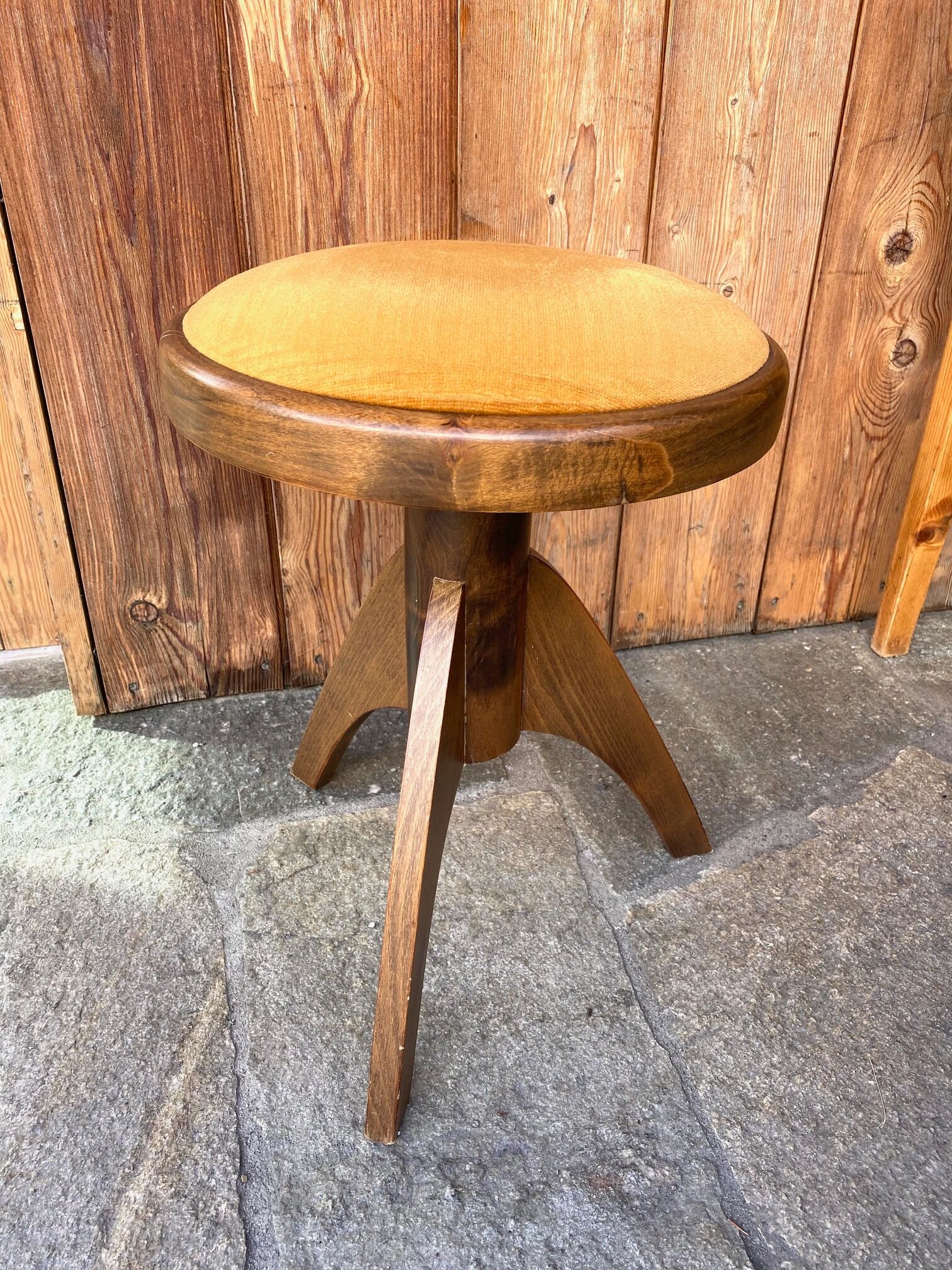 Adjustable vintage piano stool made of wood and velvet
