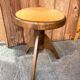 Adjustable vintage piano stool made of wood and velvet