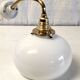 Brass and opaline gooseneck wall lamp – early twentieth century