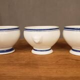 8 white lion head soup bowls with blue edging
