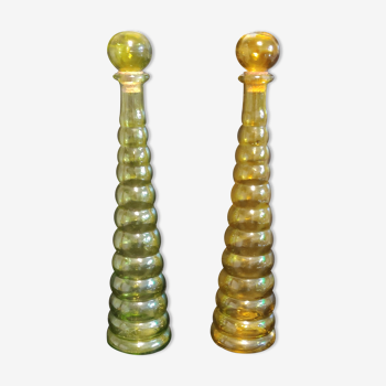 yellow and green colored glass decanters