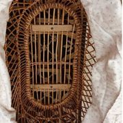 Vintage wicker cradle on wheels from the 1970s.
