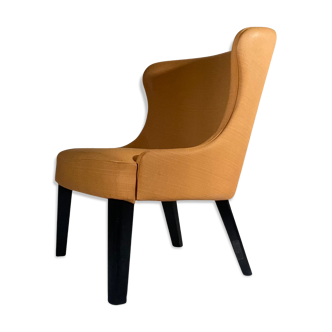 Fauteuil en simili cuire couleur abricot