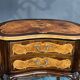 Pair of Rococo-style bedside tables with precious wood marquetry.