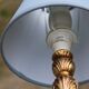 Vintage bedside lamp in gold metal – sculpted base and blue shade
