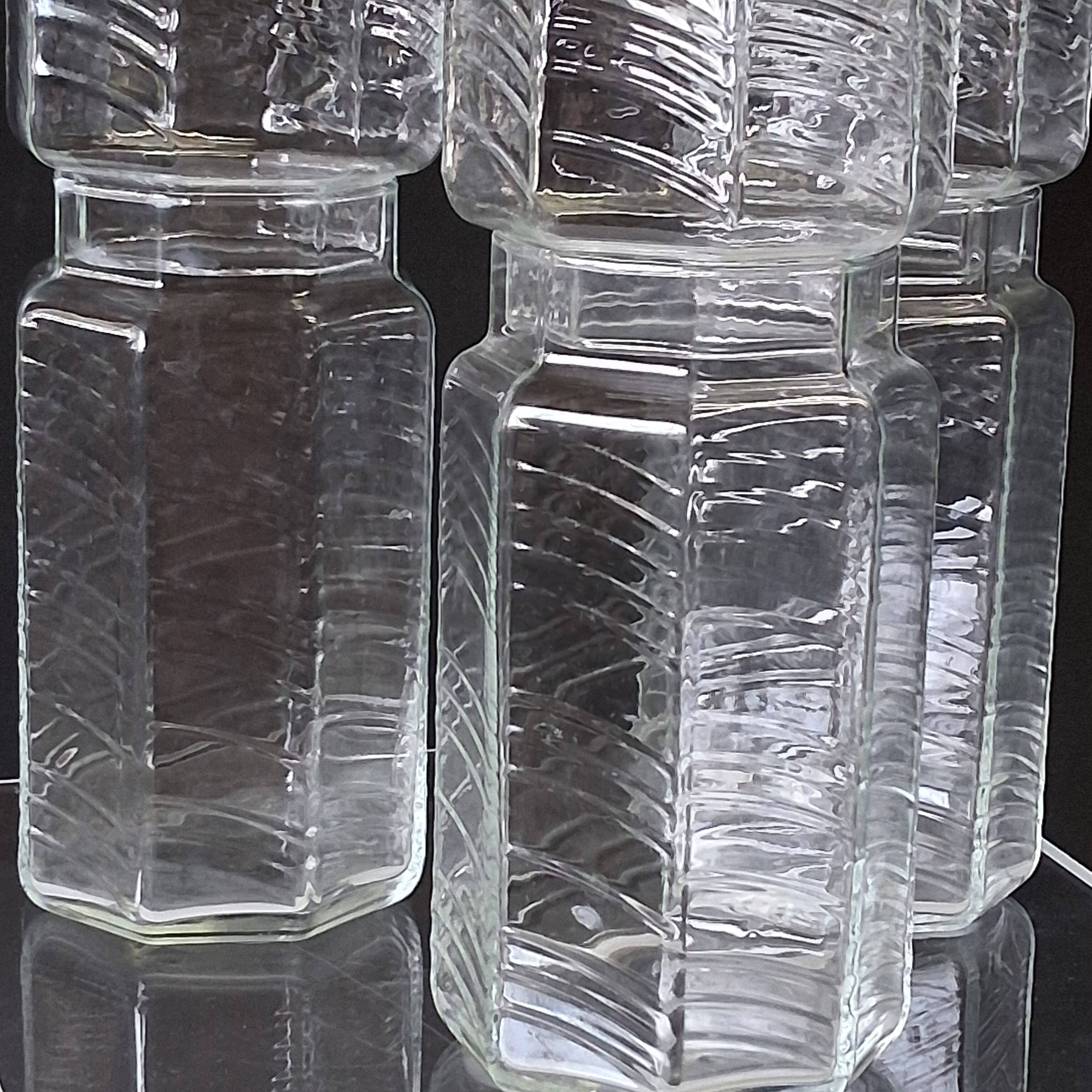 Set of 3 glass jars with old transparent lids in very good condition.