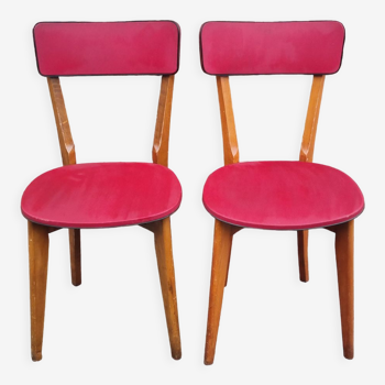 Pair of vintage 50s solid wood and red skai chairs