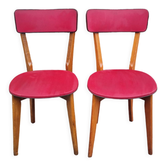 Pair of vintage 50s solid wood and red skai chairs