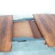 Extendable dining table in rosewood