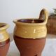 Pair of vintage wall planters in yellow glazed stoneware.