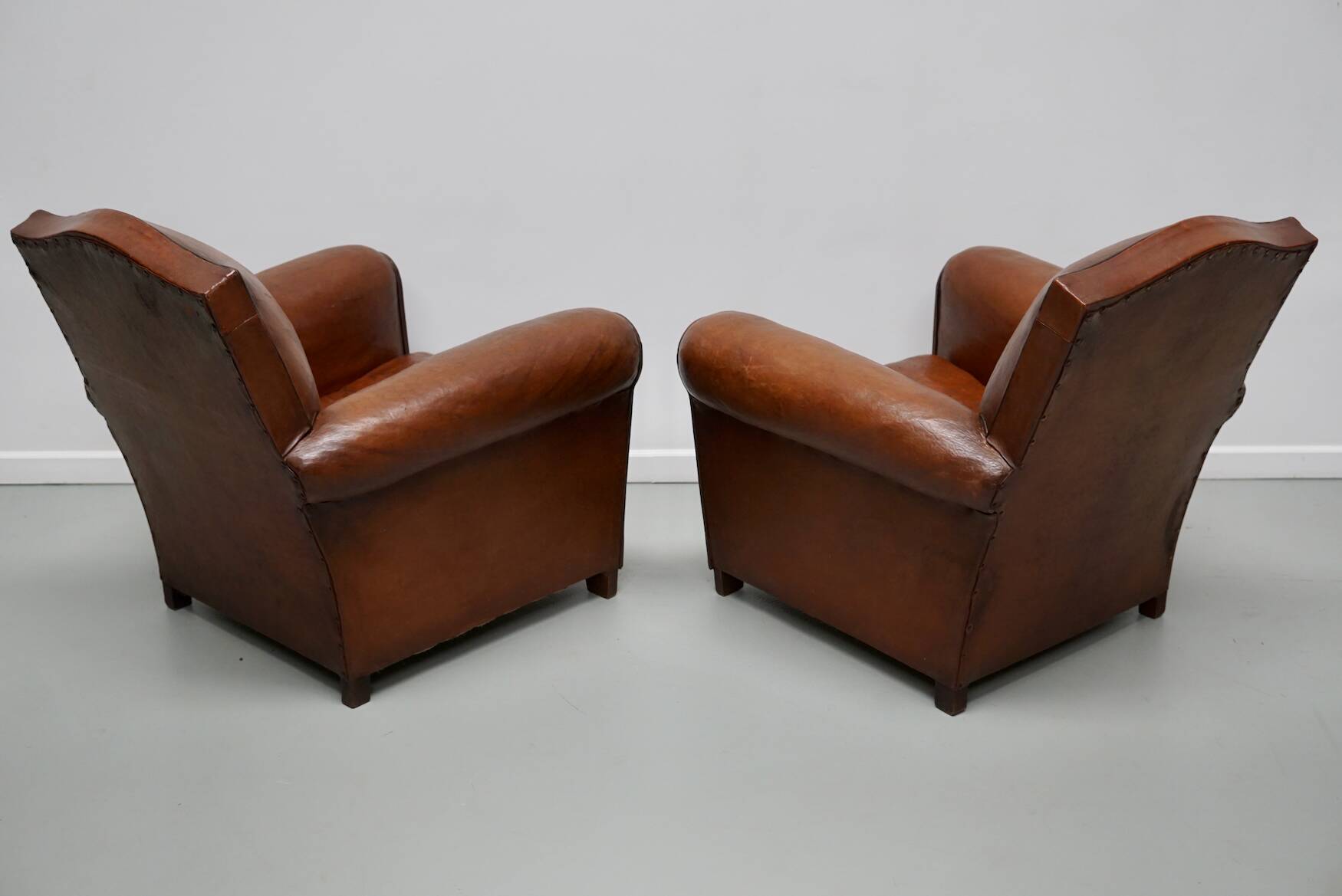 Pair of French Cognac Moustache Back Leather Club Chairs, 1940s