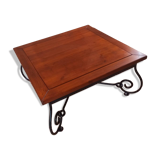 Coffee table in cherry wood with a wrought iron base.