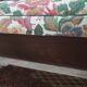 Old flowery sofa in feather
