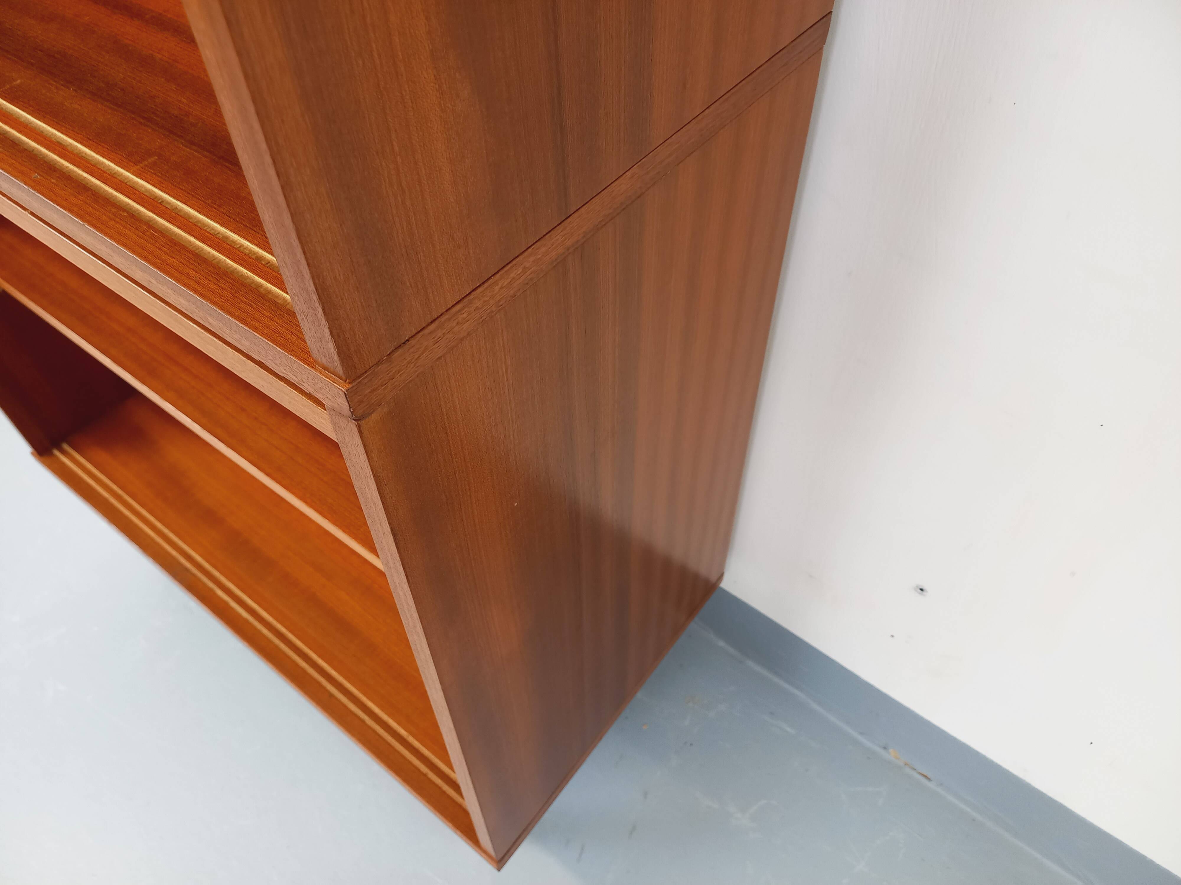 Vintage wooden bookshelf in teak style from the 1960s.