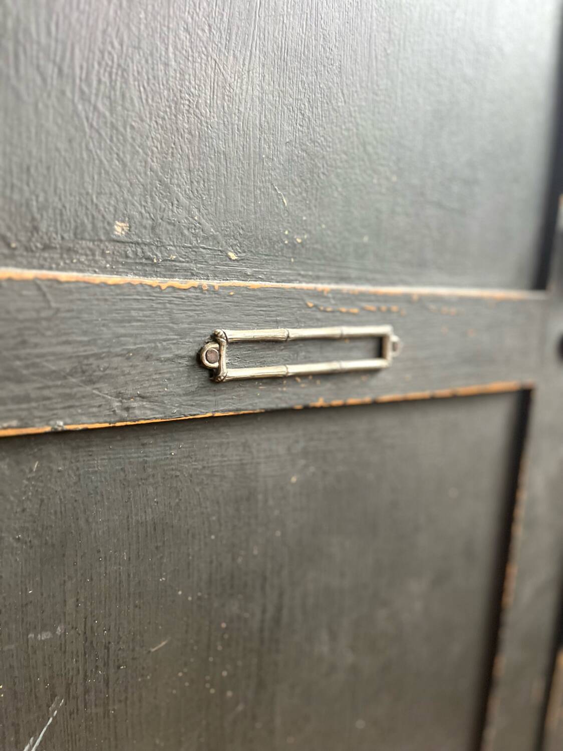 Old wooden locker with black patina