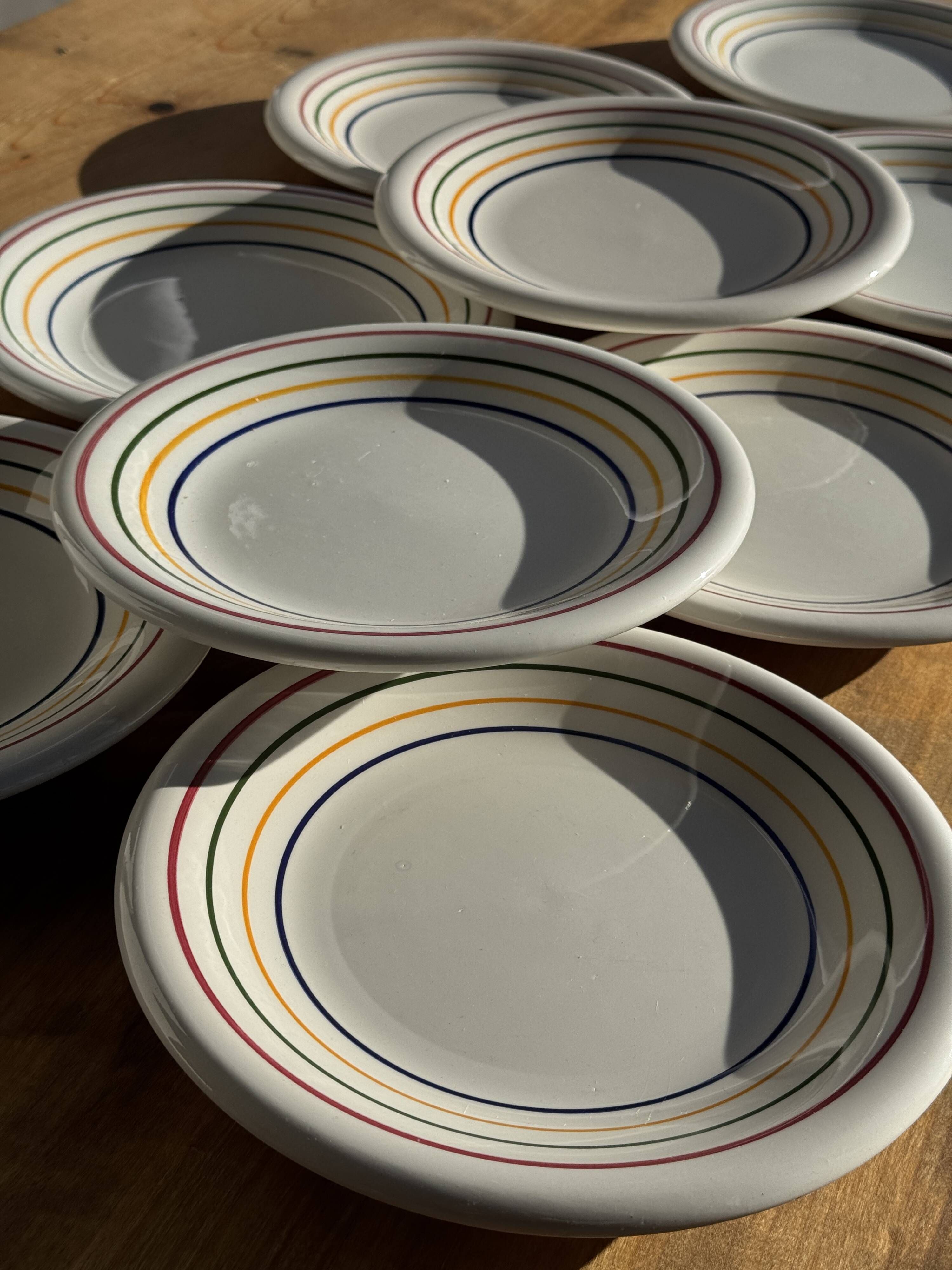 Set of 9 small Italian dessert plates Primula with red and green trim.