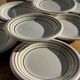 Set of 9 small Italian dessert plates Primula with red and green trim.