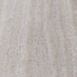 Octagonal dining table in travertine