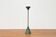 Postmodern Italian candlestick in metal and stone, 1980s.