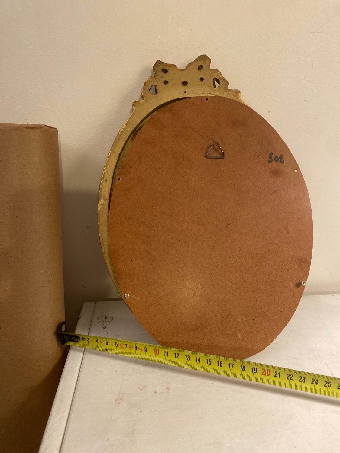 Golden oval wooden frame