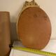 Golden oval wooden frame
