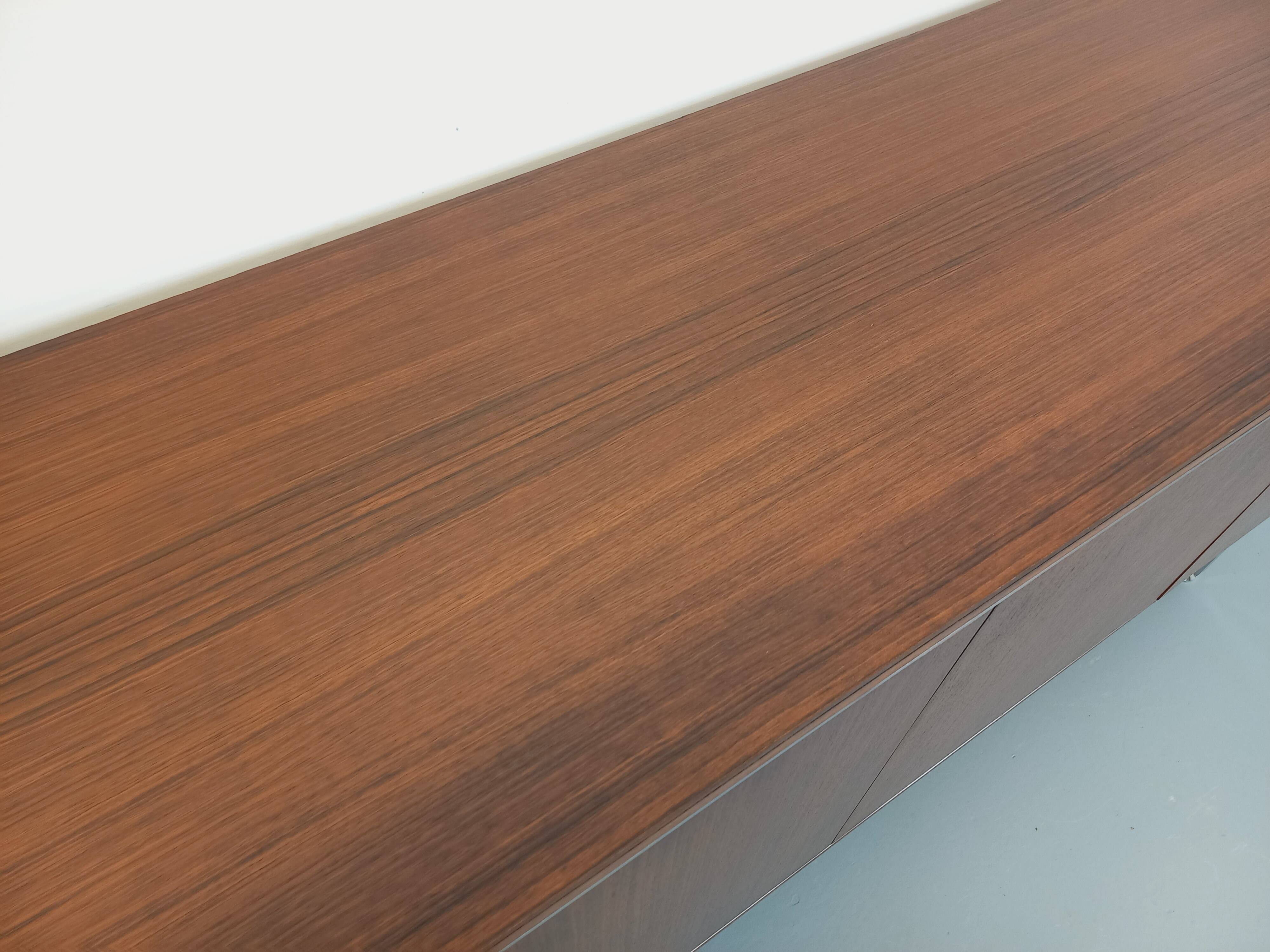 Vintage modernist enfilade in rosewood and chrome metal from the 60s and 70s.