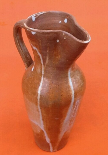 Glazed stoneware pitcher With white dripping on brown background Height: 270mm