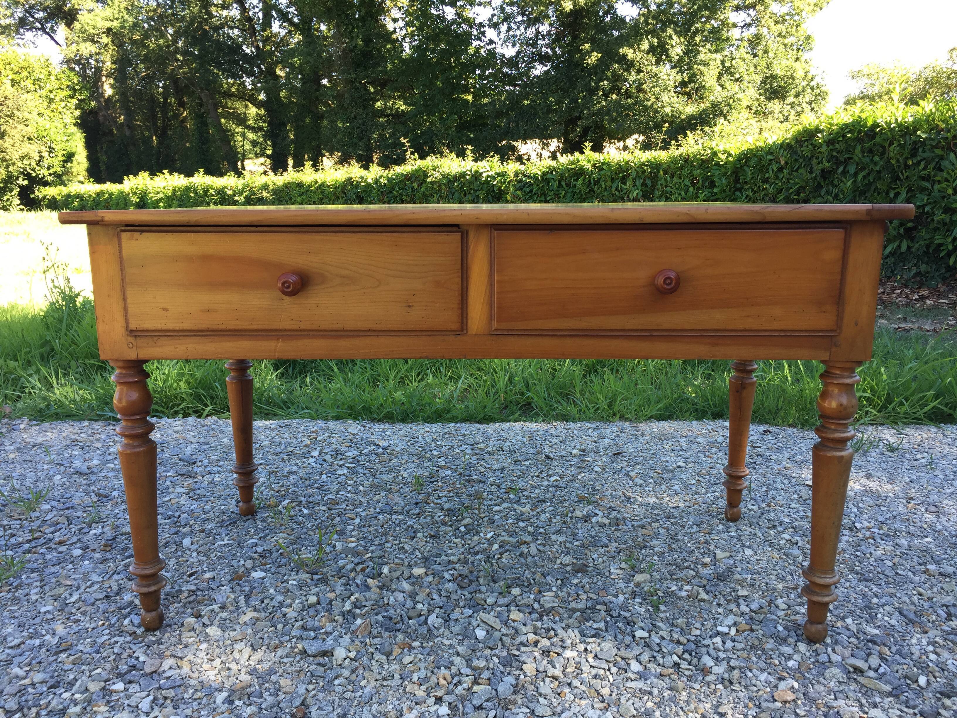 Old farmhouse table louis Philippe style in solid cherry with turned feet.