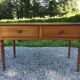 Old farmhouse table louis Philippe style in solid cherry with turned feet.