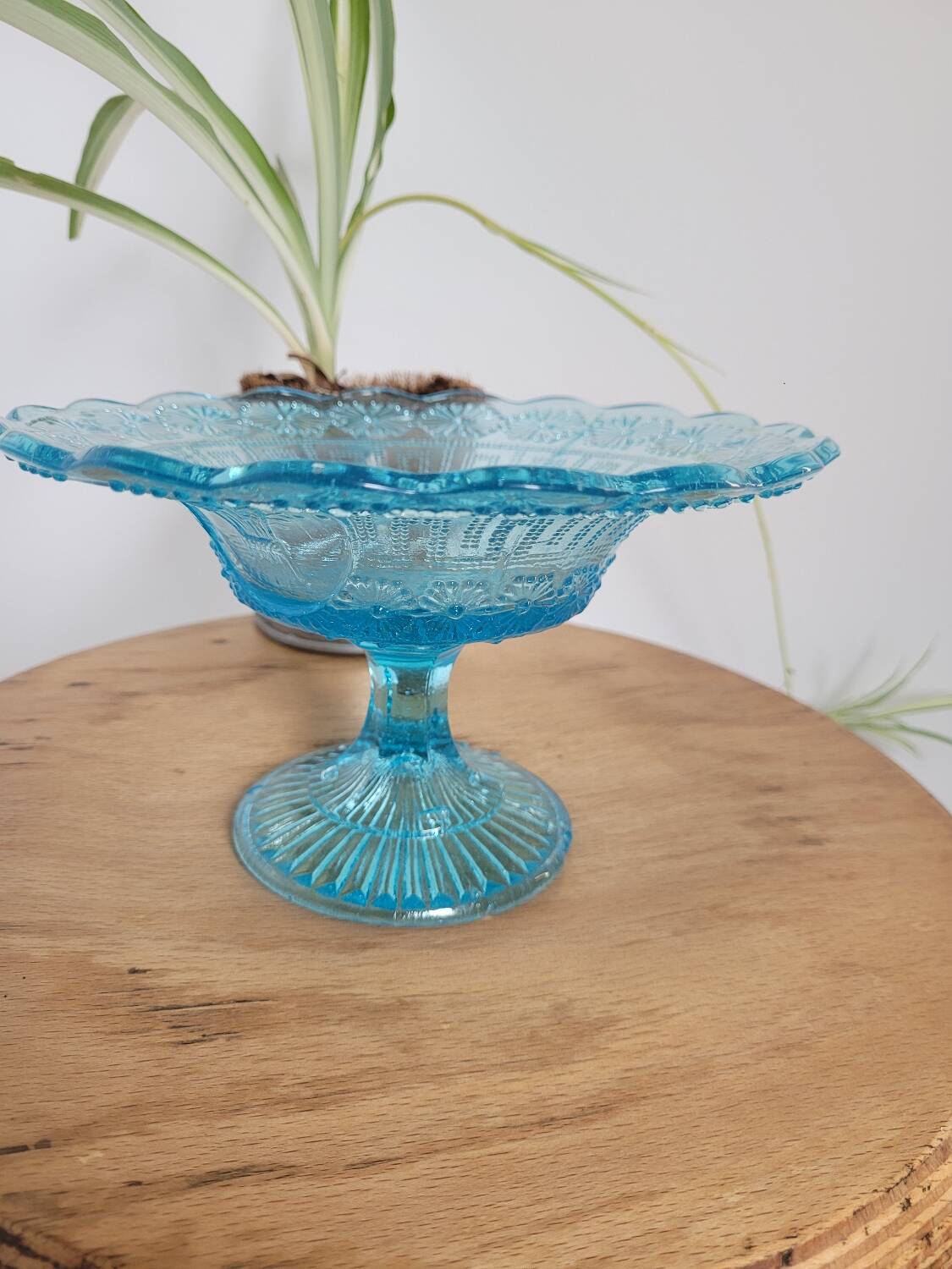 Plate on blue glass pedestal