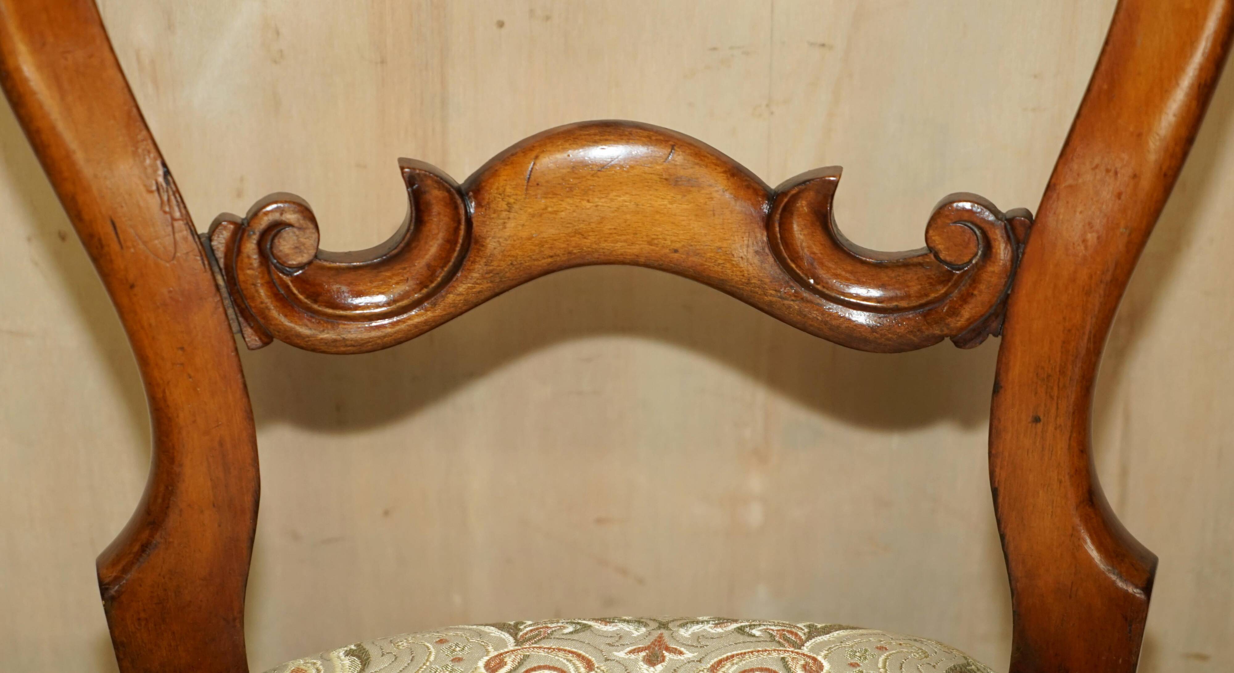 Victorian walnut dressing table chair from around 1880 with a medallion on the backrest.