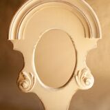 Miroir vintage en bois sculpté.