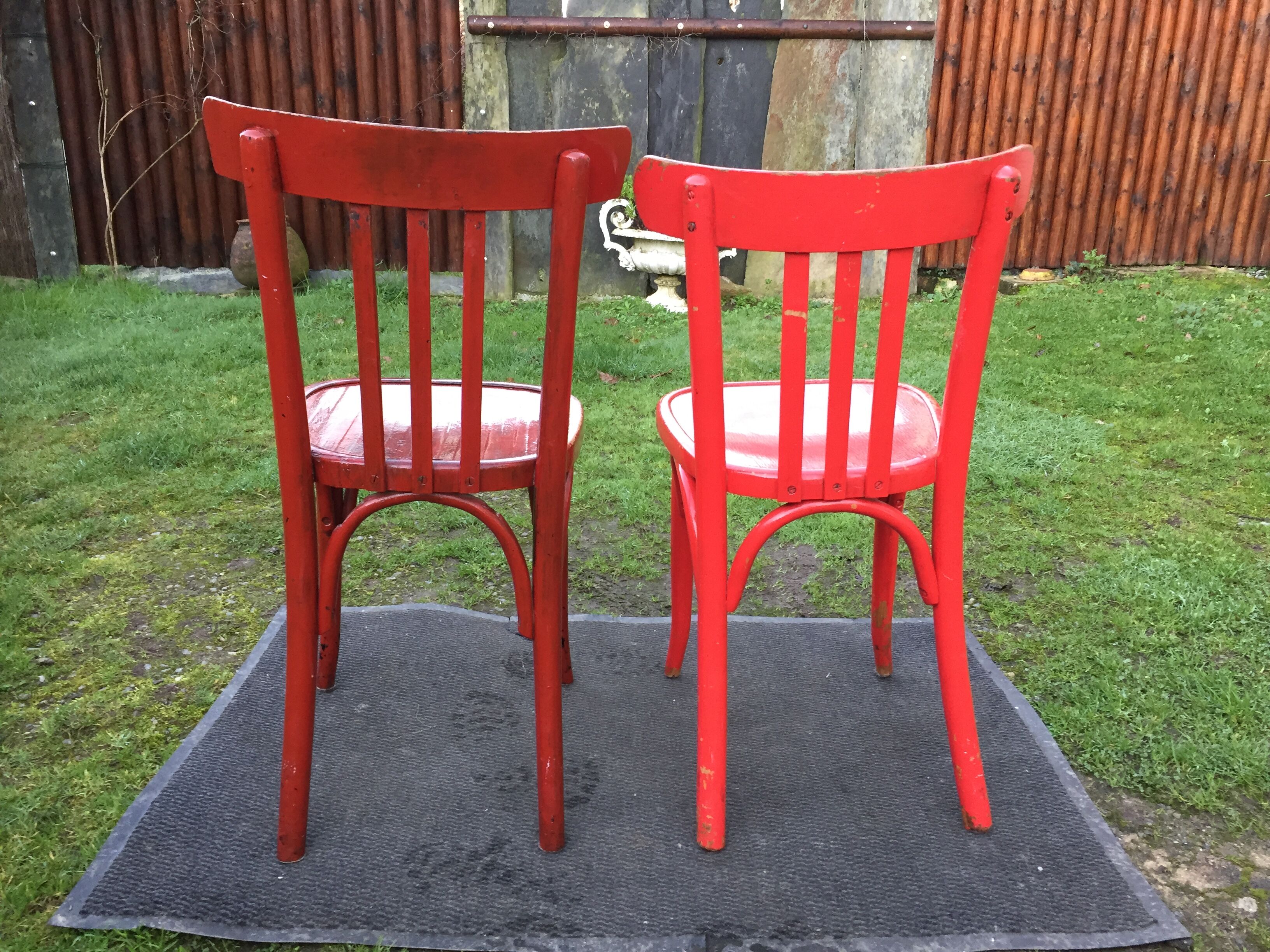 Vintage bistro chairs painted in burgundy and red