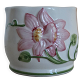 Small vintage pottery cache pot with a raised flower motif in pink.