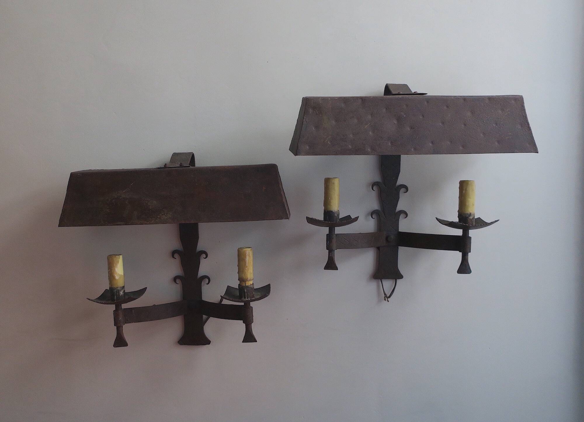 Pair of mid century Brutalist patinated iron wall lights, 1950s-60s